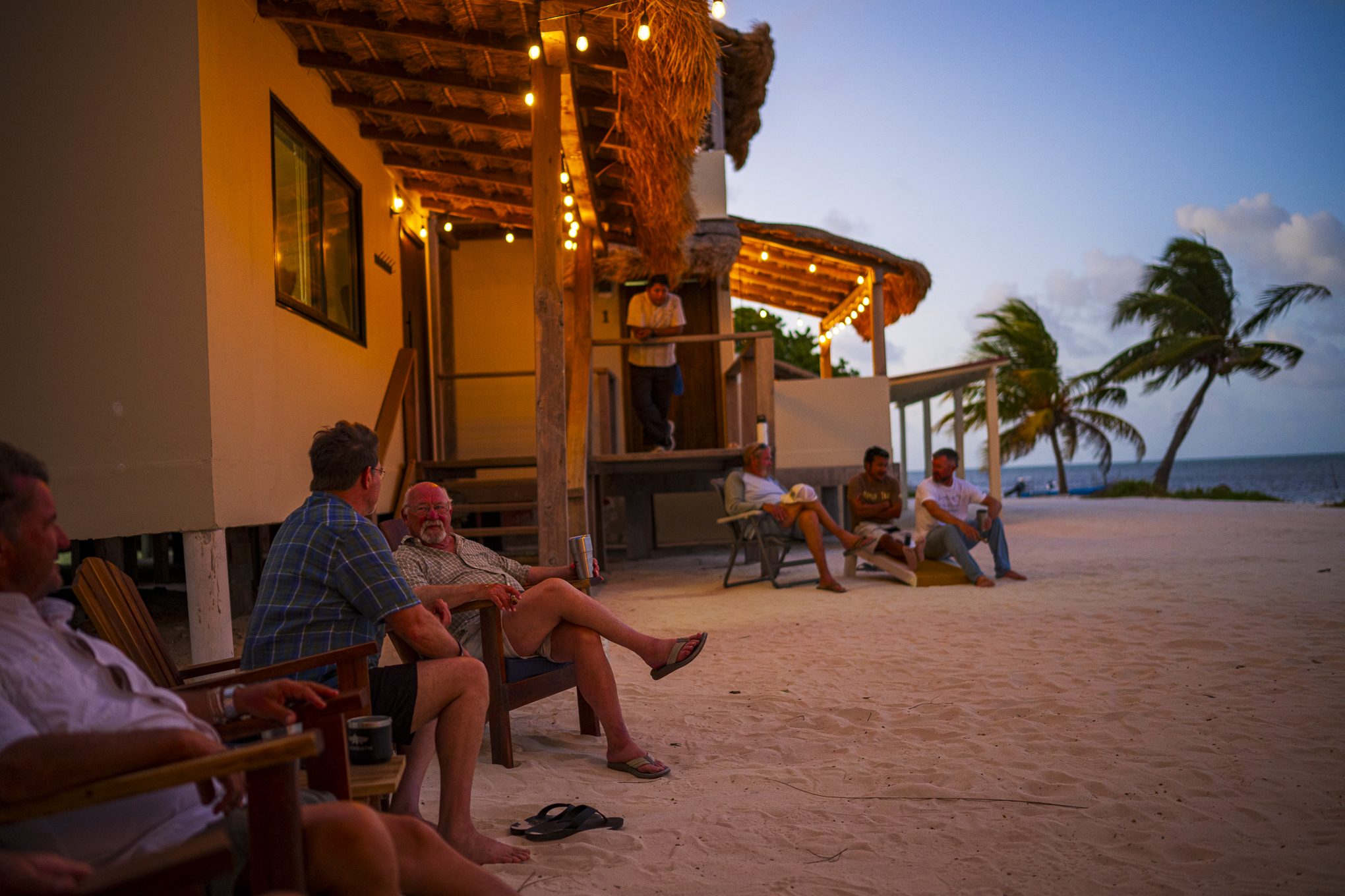 Guests relaxing outside Blacksmith Lodge at dusk